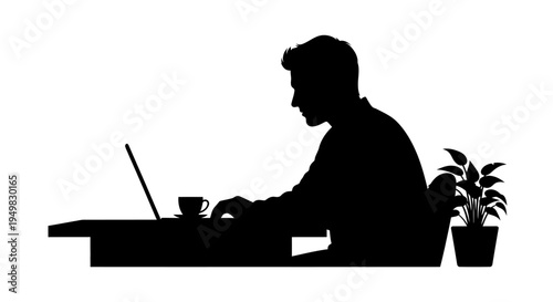 Man sitting at desk with laptop.
