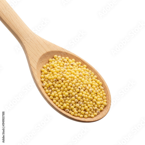 Wooden spoon with millet seeds