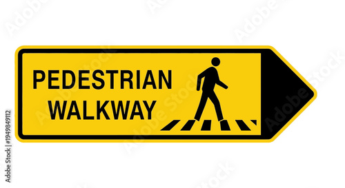 A pedestrian walks on a designated walkway marked with a sign