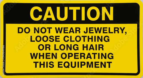 Warning sign with caution message about jewelry and clothing near industrial FBSAKLFBS equipment