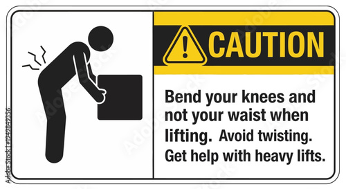 Worker bending knees lifting box with caution warning nearby indoors