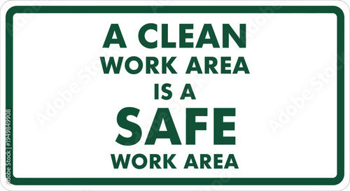 A clean and organized workspace with a sign promoting safety and cleanliness in an industrial environment viewed from a direct angle