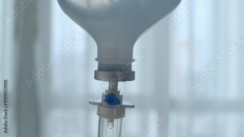 drip Ampoule CU Hanging IV bag and the fluid dripping into the tube United States Conducts drip treatment cancer Hydration in Emergency Room 4K UHD