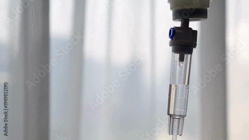 close up of drops falling from saline liquid bag IV drip in a medical setup in a hospital clinic Medical fluid dropping in intravenous drip Macro