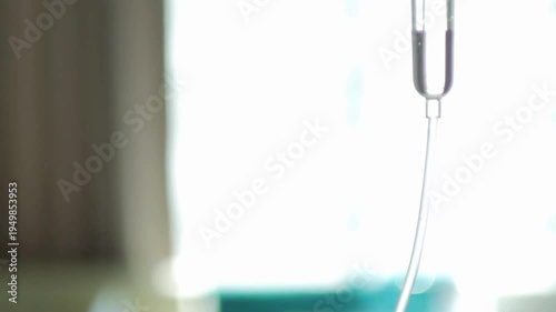 Slow Motion Set saline iv bag infusion dripping slowly A bottle of NaCI sodium chloride fluid setup for a patient's IV intravenous hydration drip In
