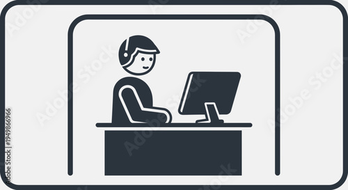 Man wearing headset sitting at desk.
