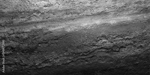 A textured black and white landscape captures the abstract grunge pattern of an old stone wall against a serene nature background of sea and sky