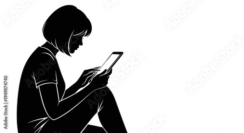 A woman sits in a dark space looking at her phone