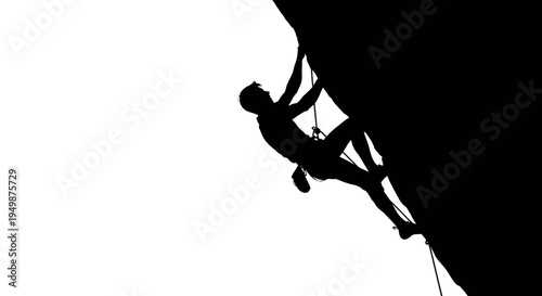 Silhouette of man rock climbing wall.