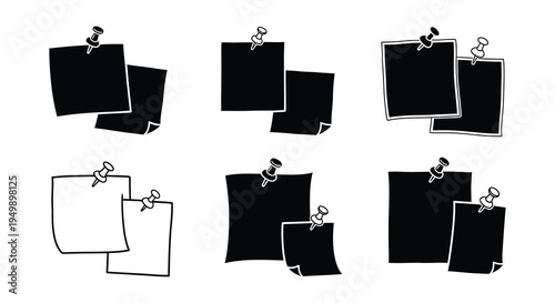 Collection of black and white note cards pinned to a surface