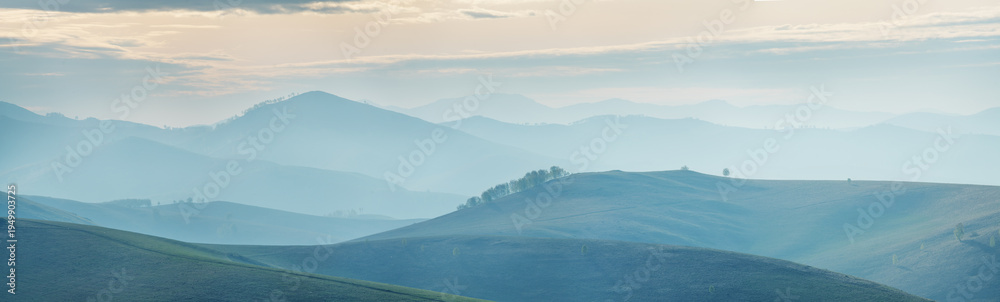 Naklejka premium Mountains and hills in the morning light, ridge gradient, panoramic view