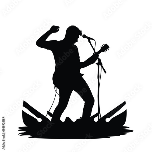 Musician playing guitar and singing on stage in silhouette
