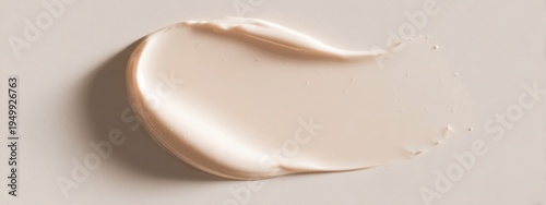 Abstract beige background with smooth creamy cosmetic texture and soft light shadows. Minimal elegant surface for beauty branding, skincare design, wellness, web, and interior decor. banner