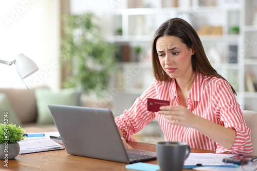 Disappointed freelance worker buying online checking laptop