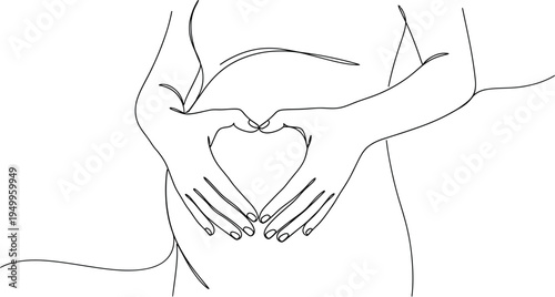 Pregnant woman's hands forming heart around belly