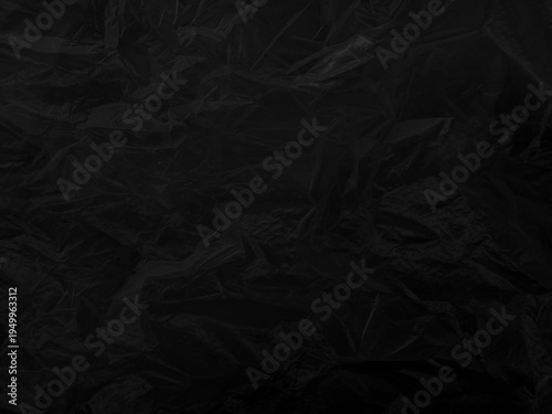 Black background plastic wrinkle bag film glossy crumpled overlay package rough wrap material pack reflection texture floor packaging retail grain pollution trash polyethylene, halloween backdrop.