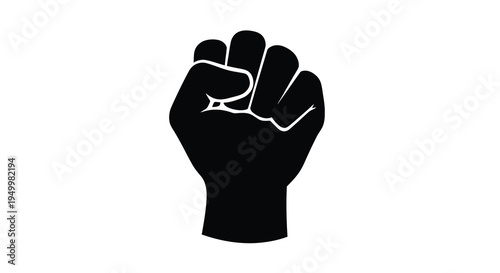A powerful clenched fist raised in a gesture of defiance silhouette