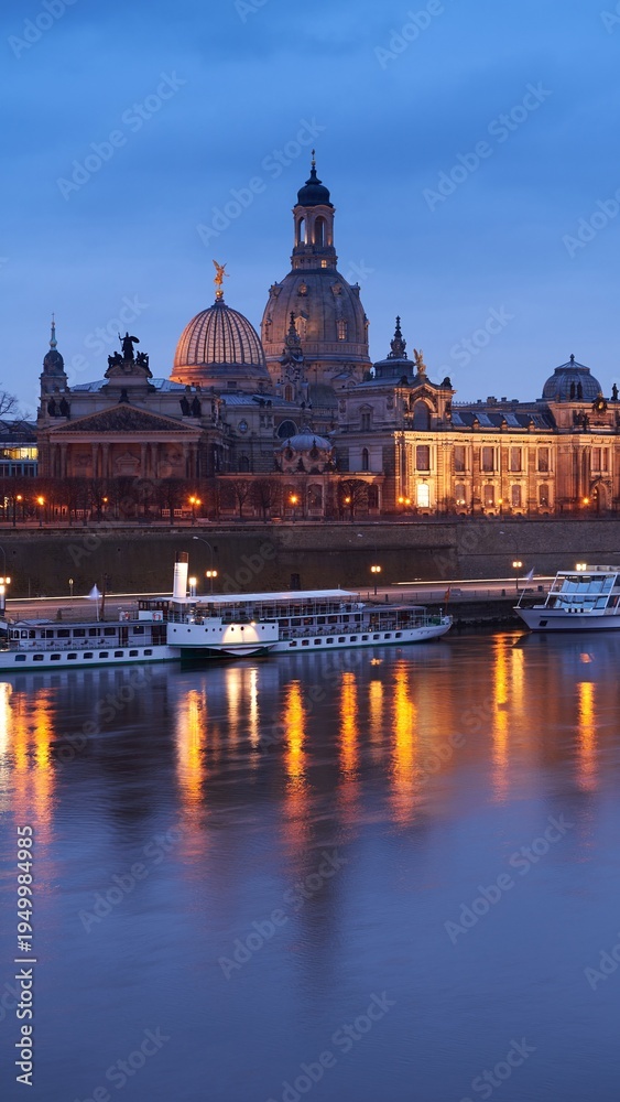 Fototapeta premium Dresden panorama Frauenkirche and historic skyline across Elbe River at dusk