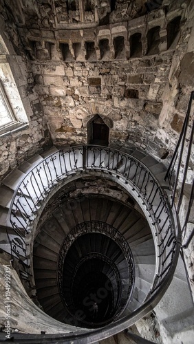Abandoned Spiral Staircase in a Decaying Historic Building.