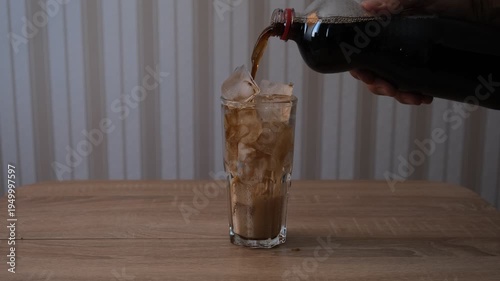 cola with ice in a glass