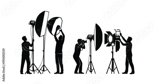 Professional photographers and studio assistants setting up lighting equipment for a photoshoot