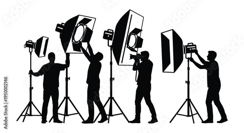 Black silhouette group of photographers and assistants working with professional studio lighting