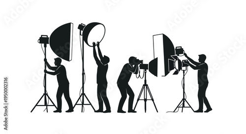 Professional photographers and studio assistants setting up lighting equipment for a photoshoot