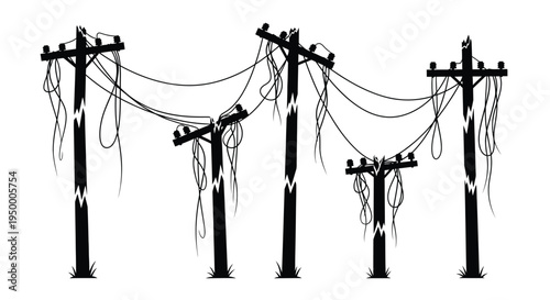 A series of broken and damaged wooden utility poles with tangled power lines hanging in the air