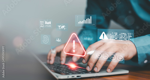 Fotografie Hands typing on laptop with glowing warning alert and virtual data dashboard interface