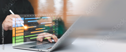 Business professional using laptop and stylus with digital project management dashboard and timeline interface. Concept of workflow planning, task scheduling, productivity tracking, agile management
