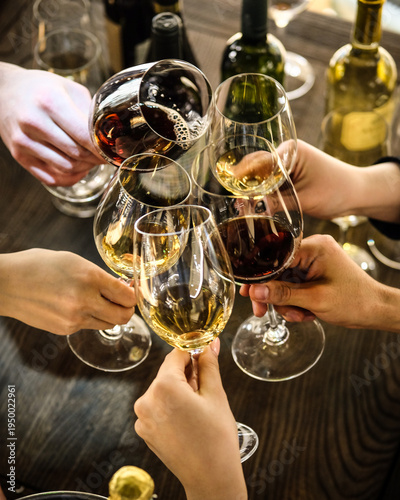 Photos Joyful Toast At Festive Gathering. Hands Reaching Out As Wine