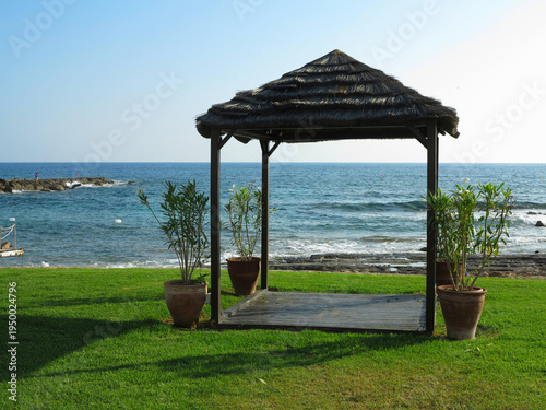 Beautiful landskape, palm trees and sun loungers at luxury resort