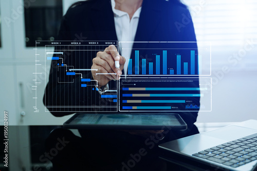 Businessman hand Project manager working and update tasks and Gantt chart scheduling virtual diagram.