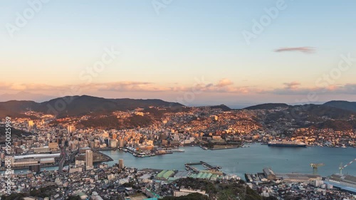 Time lapse video of Nagasaki city view from dusk to night with zoom out