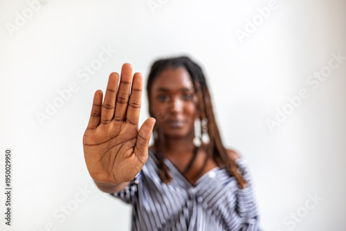 Photography Young Black woman showing stop gesture with palm of her hand