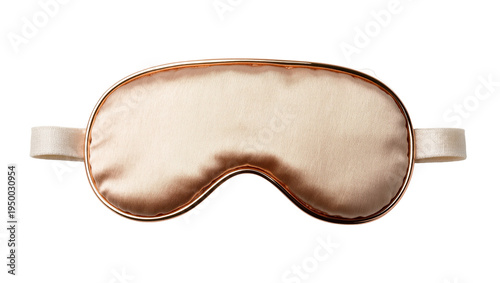 Isolated elegant rose gold silk eye mask, a premium accessory for beauty and restful sleep