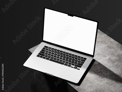Minimalist laptop display mockup on stone surface with dark dramatic background