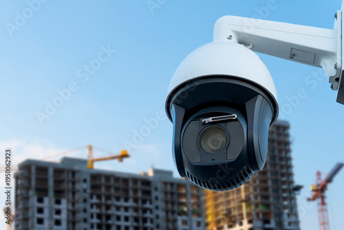 Construction site security camera monitoring building activity during the day