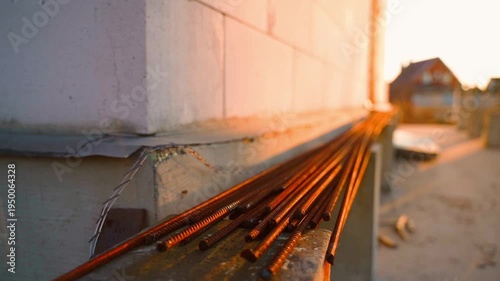 Wallpaper Mural Rusty rebar at construction site at sunrise on blurred background. Smooth camera movement Torontodigital.ca