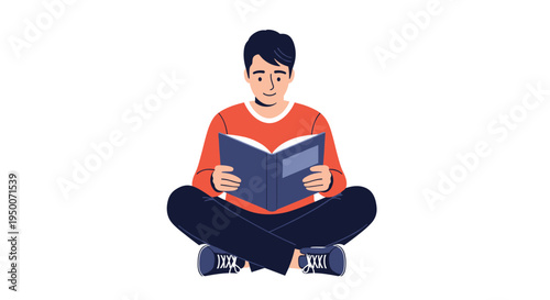 Young boy sitting cross-legged on the floor and reading a large blue book with a focused and happy expression on his face.