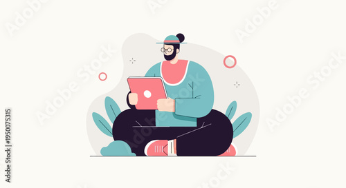 Person wearing a hat and glasses uses a laptop while sitting cross-legged with plants