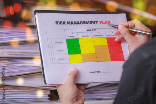 Obraz na plátně Focused professional evaluating risk priority and conducting careful business an