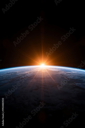 Sunrise over the earth's horizon in space