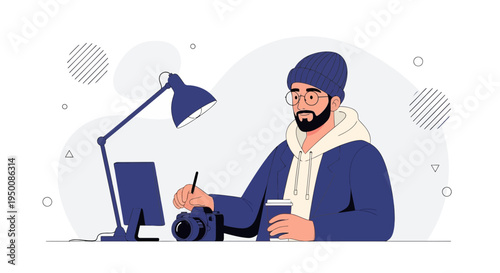 Creative Freelancer Working on Computer with Camera and Coffee