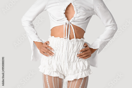 Stylish young woman in shor...