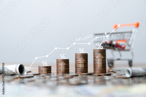 Cuadro en lienzo Rising inflation and higher living costs are represented by stacked coins with a