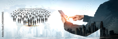 Obraz na plátně Business professional using smartphone with digital crowd and city skyline background illustrating connectivity and technology advancement in contemporary society Quark
