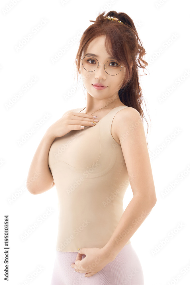 Fototapeta premium Asian beauties displaying corsets against a white background during a studio photoshoot.