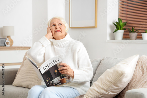 Senior woman with magazine ...