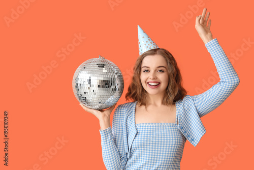 Young woman in party hat wi...